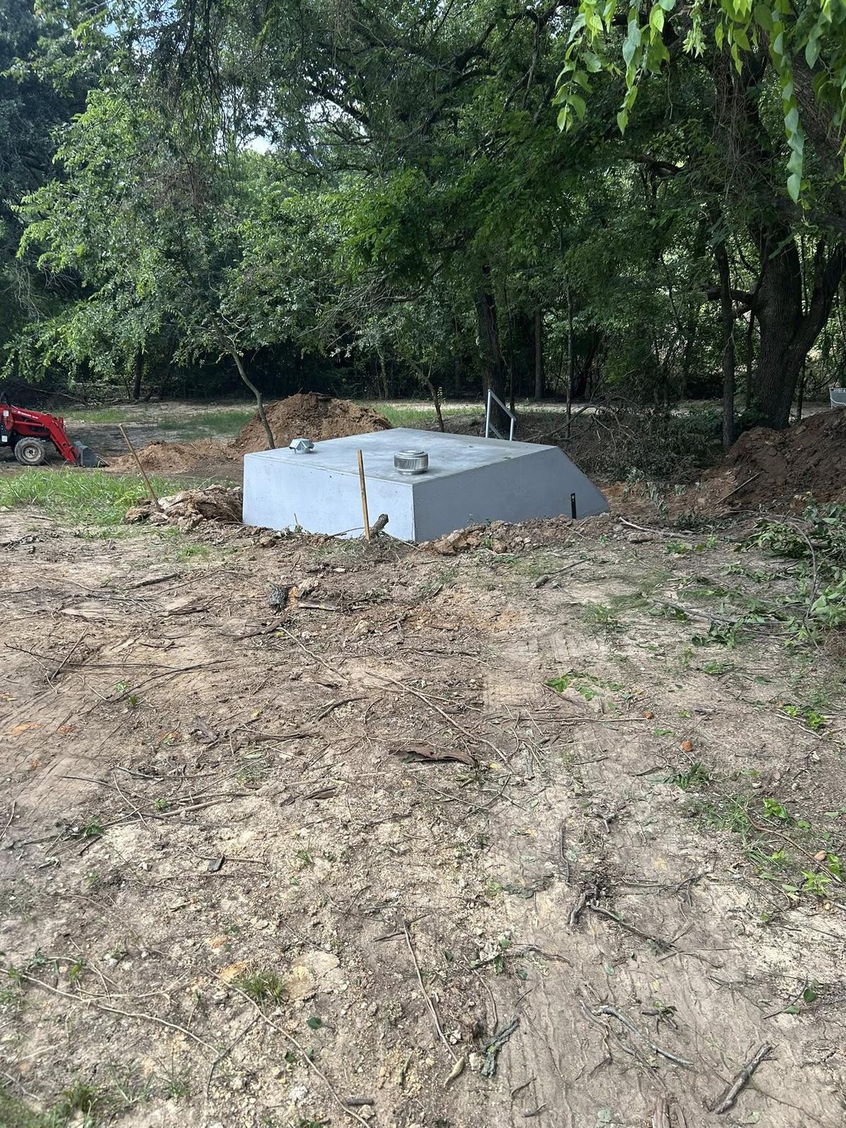 Backfilling around installed storm shelter